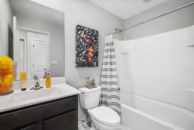 full bathroom with vanity, shower / bath combo, and toilet