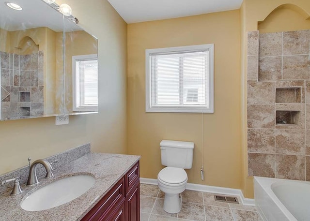 bathroom with vanity, toilet, tile patterned floors, baseboards, and visible vents