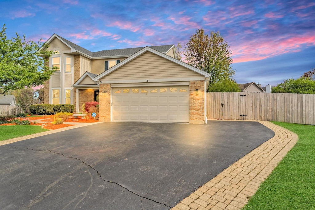 3 Regal Ct, Algonquin, IL 60102 - traditional home with fence, brick siding, a garage, a gate, and driveway