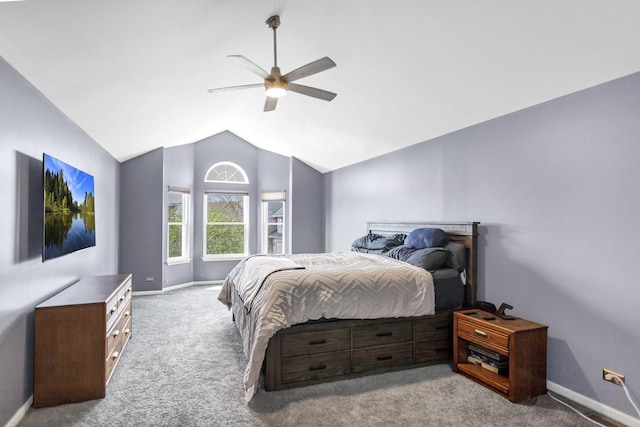 bedroom with baseboards, carpet flooring, ceiling fan, and lofted ceiling