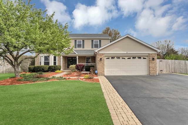 view of front of house with fence, brick siding, a garage, aphalt driveway, and a front yard