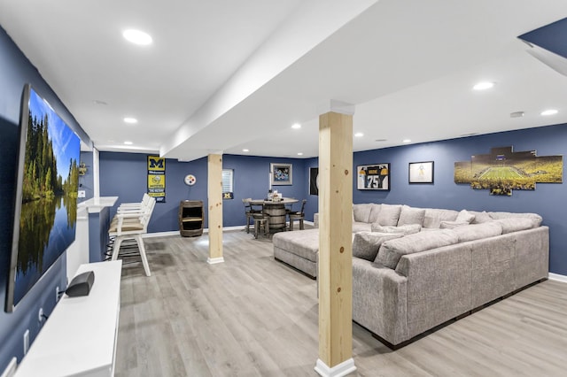 living area featuring baseboards, recessed lighting, and wood finished floors