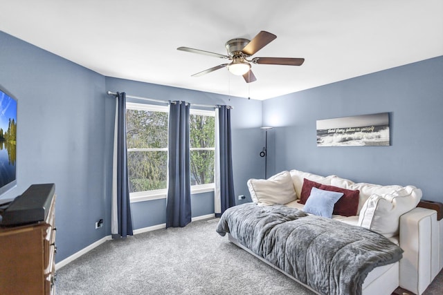 bedroom featuring baseboards, ceiling fan, and carpet