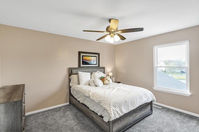 bedroom with carpet flooring, baseboards, and ceiling fan