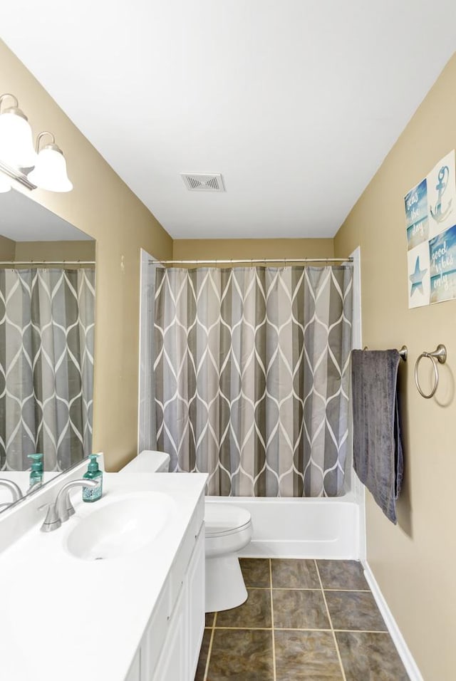 bathroom featuring vanity, tile patterned flooring, visible vents, shower / bath combination with curtain, and toilet