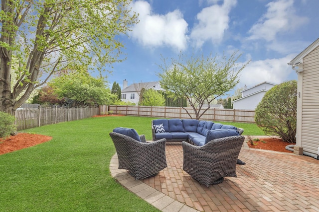 view of patio featuring a fenced backyard and an outdoor living space