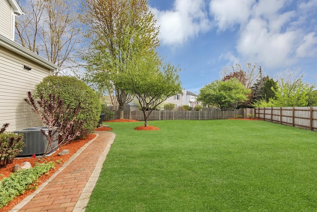 view of yard featuring a fenced backyard and cooling unit