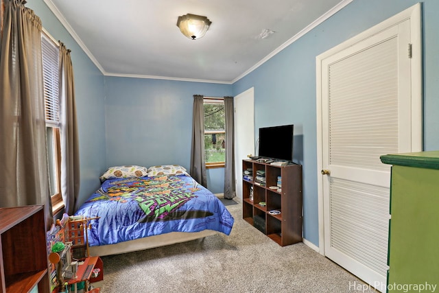 bedroom featuring carpet floors, ornamental molding, and baseboards