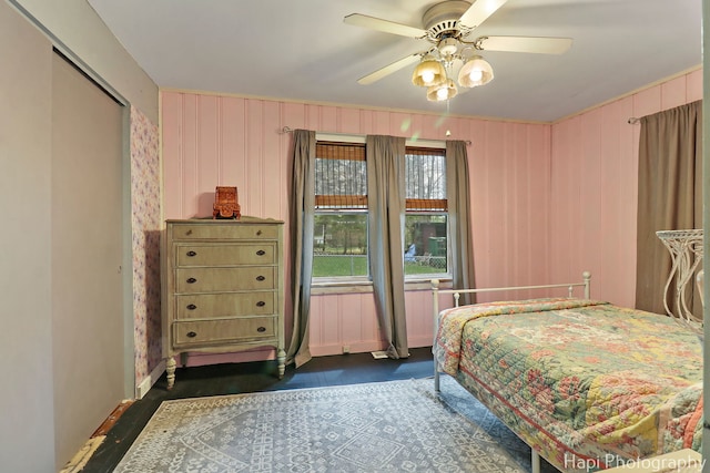 bedroom with ceiling fan and wood finished floors