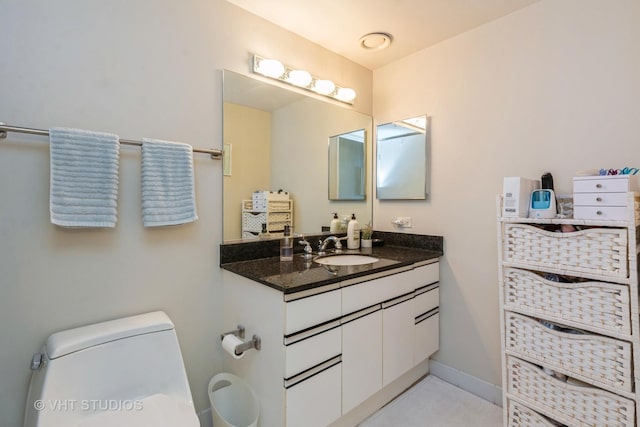 bathroom with vanity and toilet