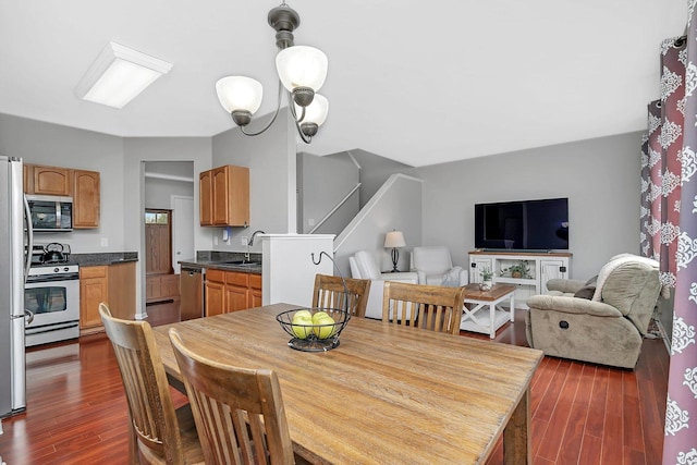 dining room with dark wood-style floors and stairway