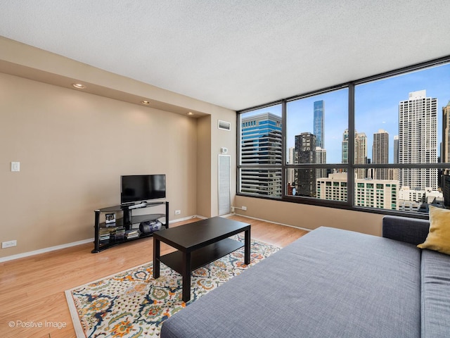 405 N Wabash Ave Unit 2315, Chicago, IL 60611 - living area featuring baseboards, a textured ceiling, recessed lighting, and wood finished floors