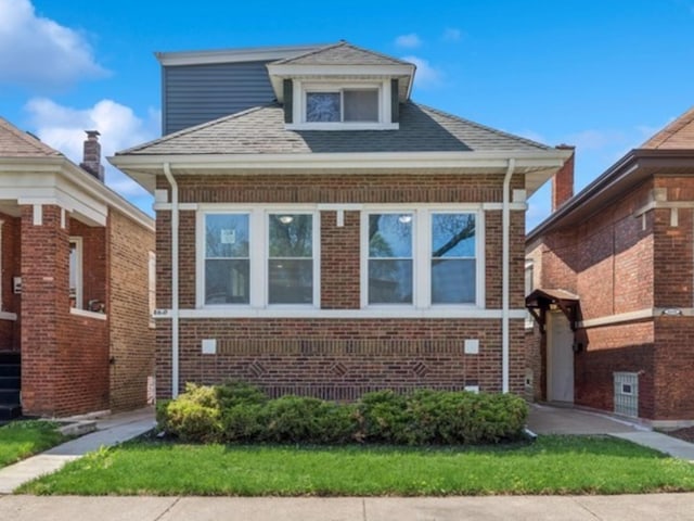 view of front of property featuring brick siding
