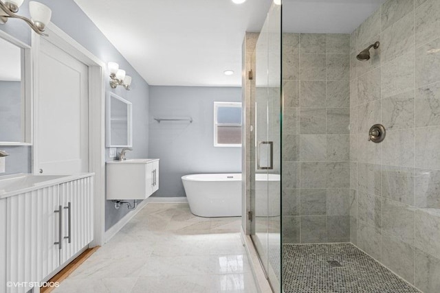 bathroom with marble finish floor, two vanities, a soaking tub, a sink, and a shower stall