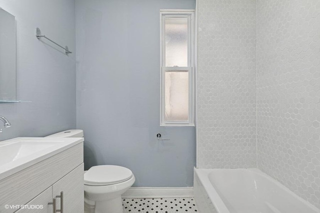 full bath with toilet, tile patterned floors, baseboards, and vanity