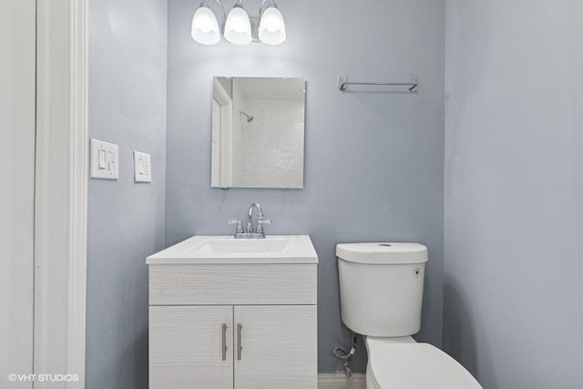 bathroom with toilet and vanity