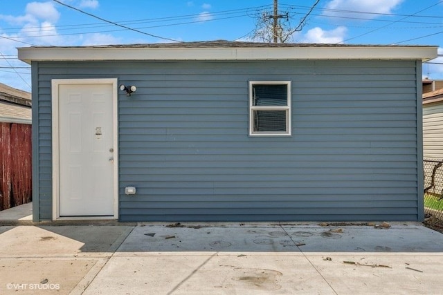 garage with fence