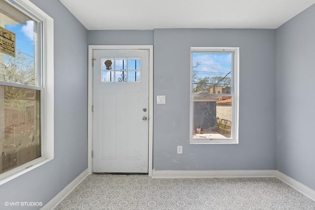 entryway featuring baseboards
