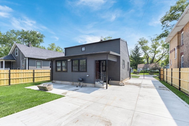 16910 Lincoln St, Hazel Crest, IL 60429 - back of property featuring entry steps, a patio, and concrete driveway