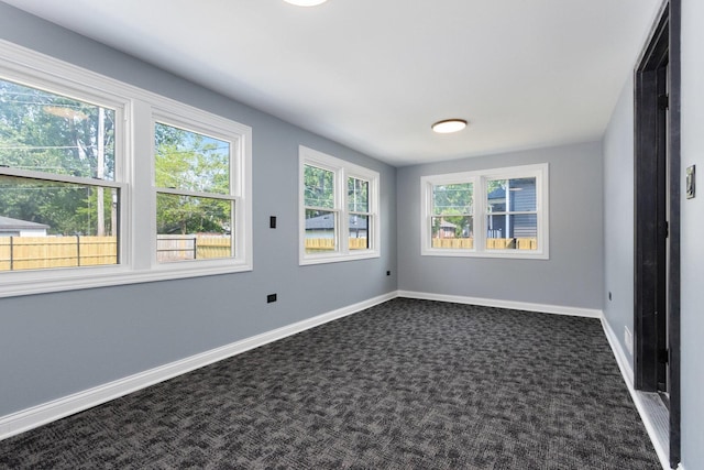 16910 Lincoln St, Hazel Crest, IL 60429 - empty room featuring dark colored carpet and baseboards