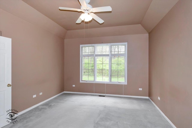 unfurnished room featuring baseboards, ceiling fan, carpet, and vaulted ceiling
