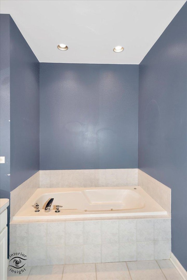 bathroom featuring vanity, tile patterned floors, and a jetted tub