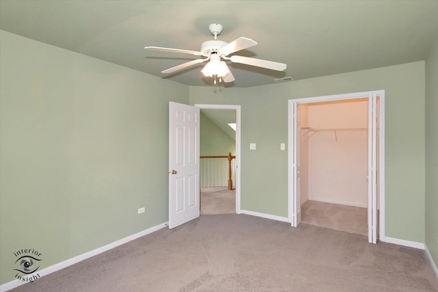 unfurnished bedroom featuring baseboards, a ceiling fan, carpet flooring, and visible vents