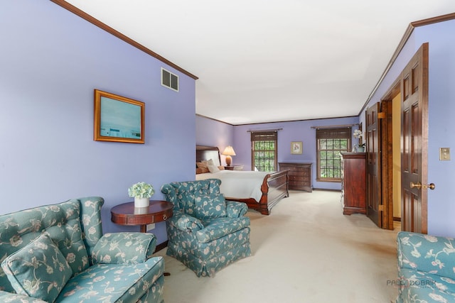 bedroom with visible vents, ornamental molding, and light colored carpet
