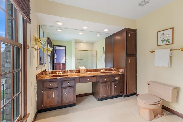 bathroom with double vanity, toilet, recessed lighting, visible vents, and a stall shower