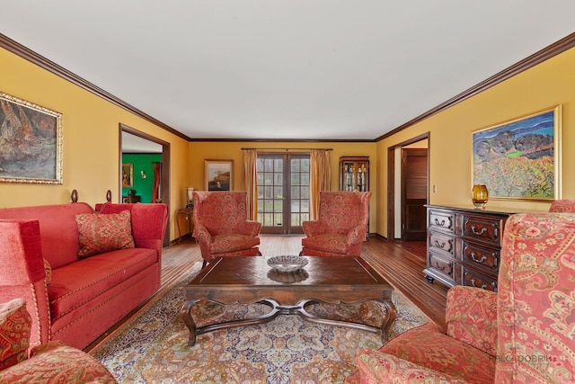 living area with crown molding and wood finished floors