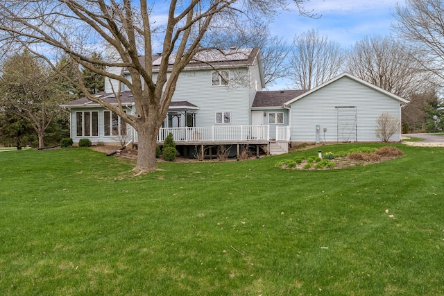 17 Thistle Trl, Caledonia, IL 61011 - back of house featuring a deck, a lawn, a shingled roof, and a sunroom