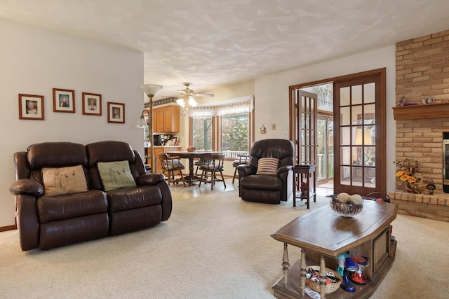 17 Thistle Trl, Caledonia, IL 61011 - living area with carpet floors, a fireplace, ceiling fan, and a textured ceiling