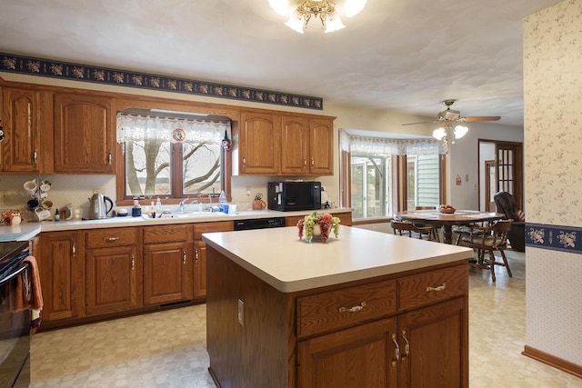 17 Thistle Trl, Caledonia, IL 61011 - kitchen with black appliances, light flooring, brown cabinetry, wallpapered walls, and light countertops