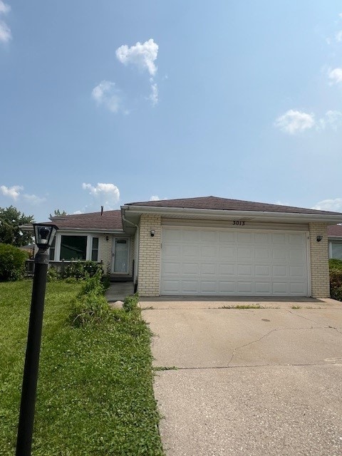 3013 Crescenzo Dr S, Chicago Heights, IL 60411 - ranch-style house with brick siding, a front lawn, an attached garage, and driveway