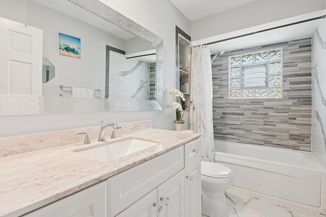 bathroom featuring vanity, marble finish floor, toilet, and shower / tub combo