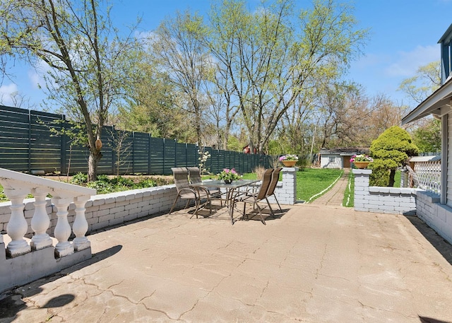 view of patio / terrace with a fenced backyard and outdoor dining space