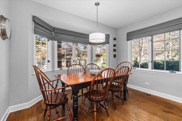 441 Oakland Dr, Highland Park, IL 60035 - dining room featuring baseboards, healthy amount of natural light, and wood finished floors