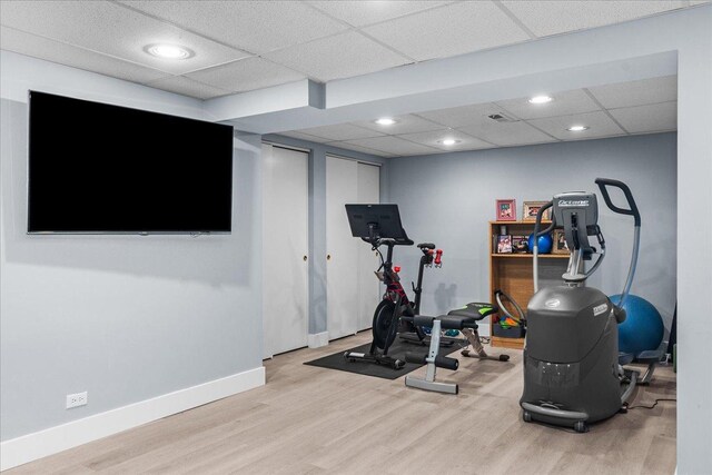 441 Oakland Dr, Highland Park, IL 60035 - exercise room featuring wood finished floors, baseboards, and a drop ceiling