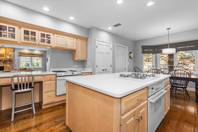 441 Oakland Dr, Highland Park, IL 60035 - kitchen featuring white appliances, light brown cabinetry, dark wood-style flooring, recessed lighting, and glass insert cabinets
