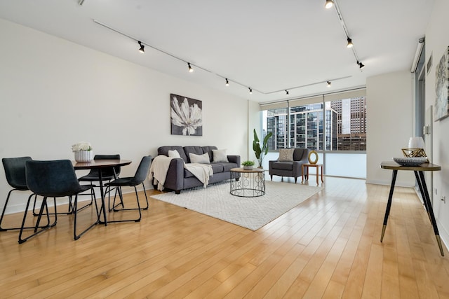 8 E Randolph St Unit 3002, Chicago, IL 60601 - living room featuring track lighting, a wall of windows, and light wood-type flooring