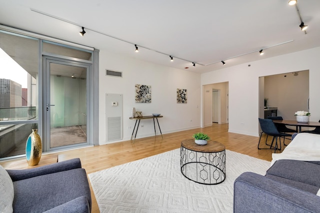 8 E Randolph St Unit 3002, Chicago, IL 60601 - living area with track lighting, light wood finished floors, and visible vents