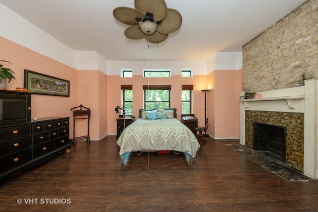 3912 S Prairie Ave, Chicago, IL 60653 - bedroom with wood finished floors, a tiled fireplace, and a ceiling fan