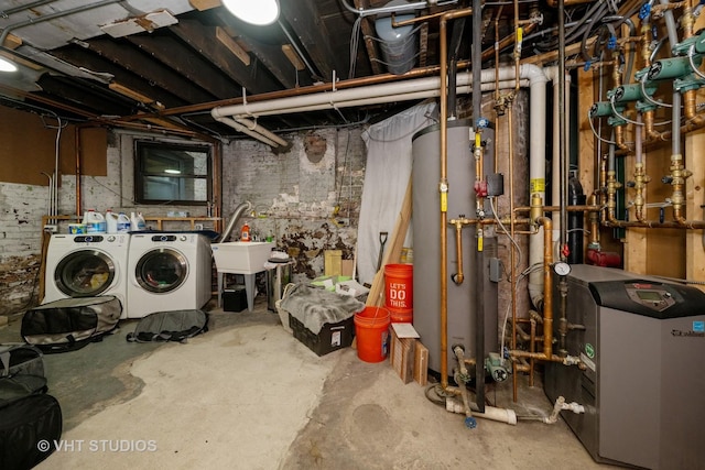 3912 S Prairie Ave, Chicago, IL 60653 - unfinished below grade area with washer and clothes dryer, a heating unit, and water heater