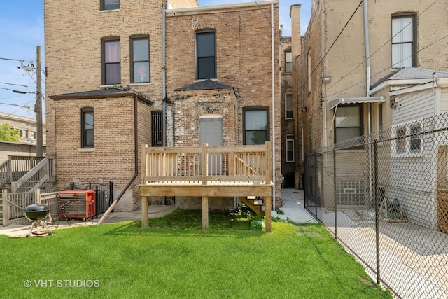 3912 S Prairie Ave, Chicago, IL 60653 - rear view of house with brick siding and a wooden deck