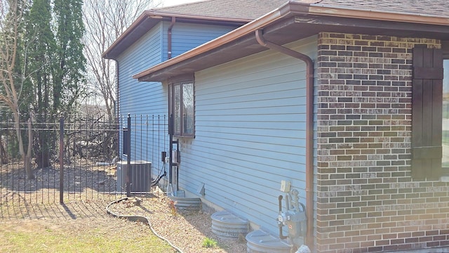 4951 Crest Ct, Country Club Hills, IL 60478 - view of property exterior with fence, cooling unit, and roof with shingles