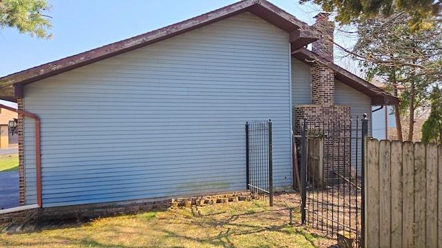4951 Crest Ct, Country Club Hills, IL 60478 - view of side of home featuring fence and a chimney