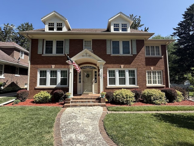 1402 W Lincoln Blvd, Freeport, IL 61032 - view of front facade with brick siding and a front lawn