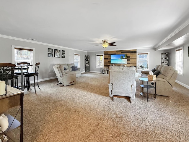 1402 W Lincoln Blvd, Freeport, IL 61032 - living area with carpet, ornamental molding, ceiling fan, and plenty of natural light
