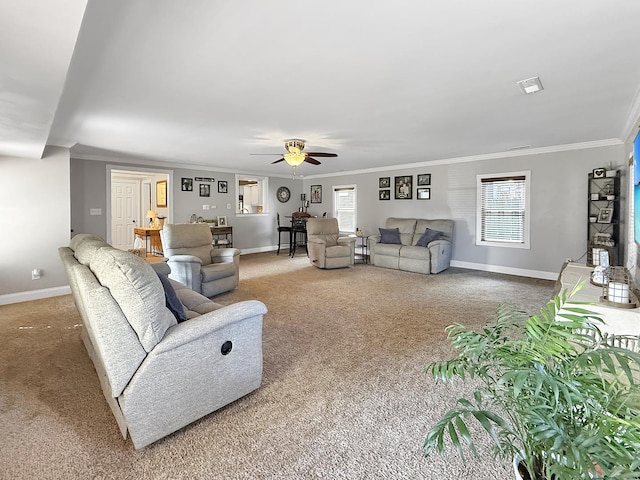 1402 W Lincoln Blvd, Freeport, IL 61032 - carpeted living room with ornamental molding, a ceiling fan, and plenty of natural light