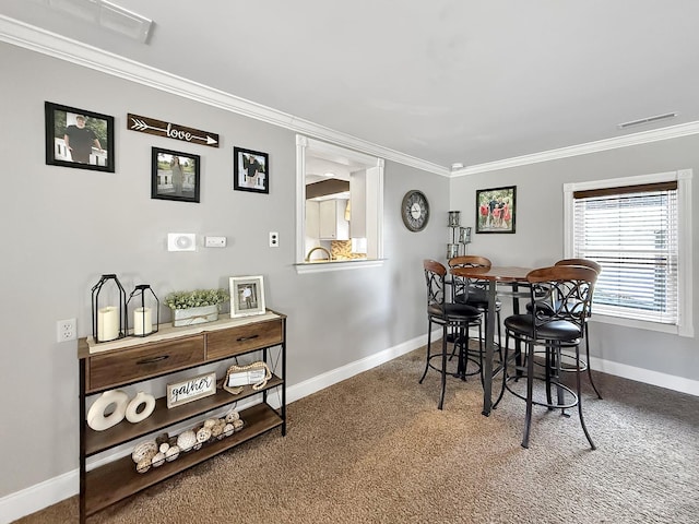 1402 W Lincoln Blvd, Freeport, IL 61032 - dining space with ornamental molding and carpet floors
